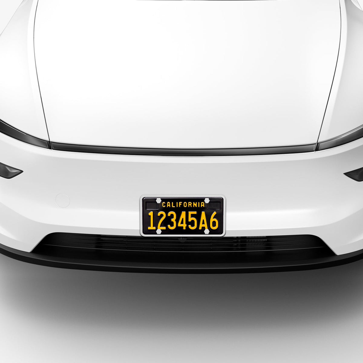 ACP12020 - License Plate Frame | LP100 in White showing the front installed to the front of the car