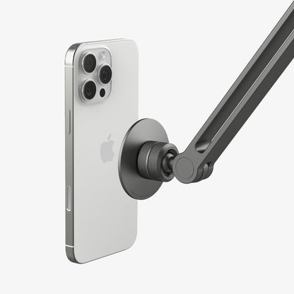 AMP09694 - Phone OneTap Clamp (MagFit) in Space Gray showing the back of the device hovering infront of the onetap clamp