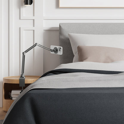 AMP09694 - Phone OneTap Clamp (MagFit) in Space Gray showing the attached beside the bed
