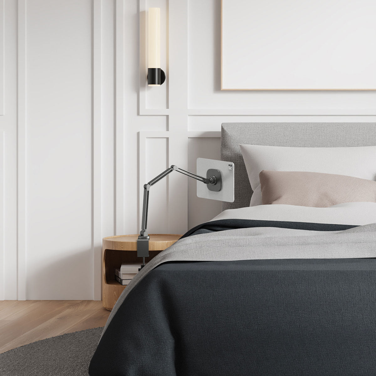 AMP09191 - OneTap Clamp in Space Gray showing the clamp stand with the device attached, clamped to a night stand beside the bed