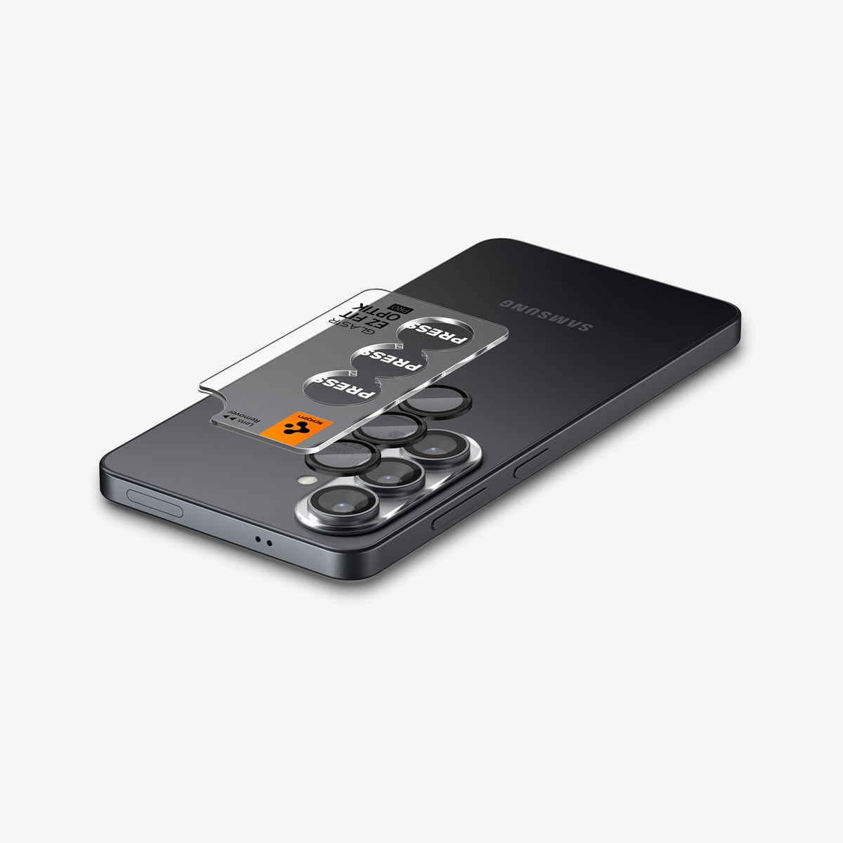 AGL11094 - Galaxy S26 Optik EZ Fit Lens Pro Protector showing the lens protector tray hovering above the lens protector and the device