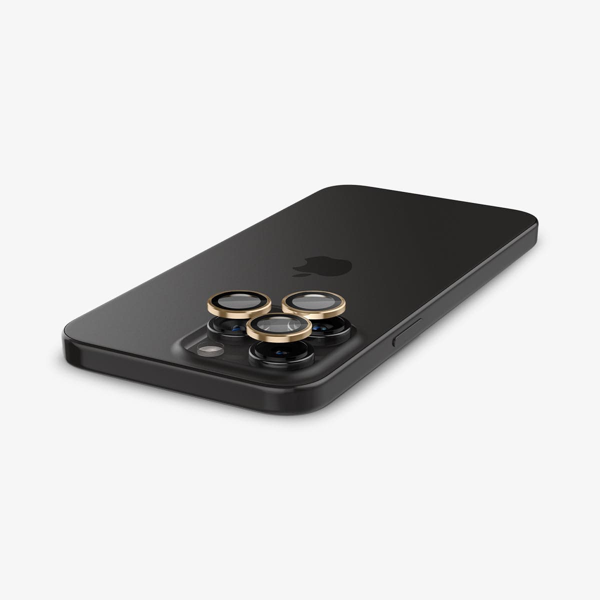 AGL05598 - iPhone 15 Pro / 15 Pro Max Optik Pro Lens Protector in gold showing the back with optik pro lens protector hovering above the camera lens