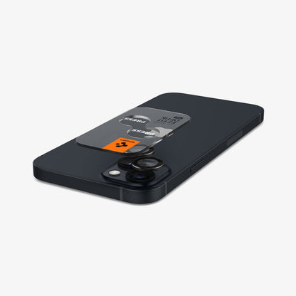 AGL05213 - iPhone 14 / 14 Plus Optik Pro Lens Protector in black showing the back with device laying flat and lens protector and ez fit tray hovering slightly above camera lens