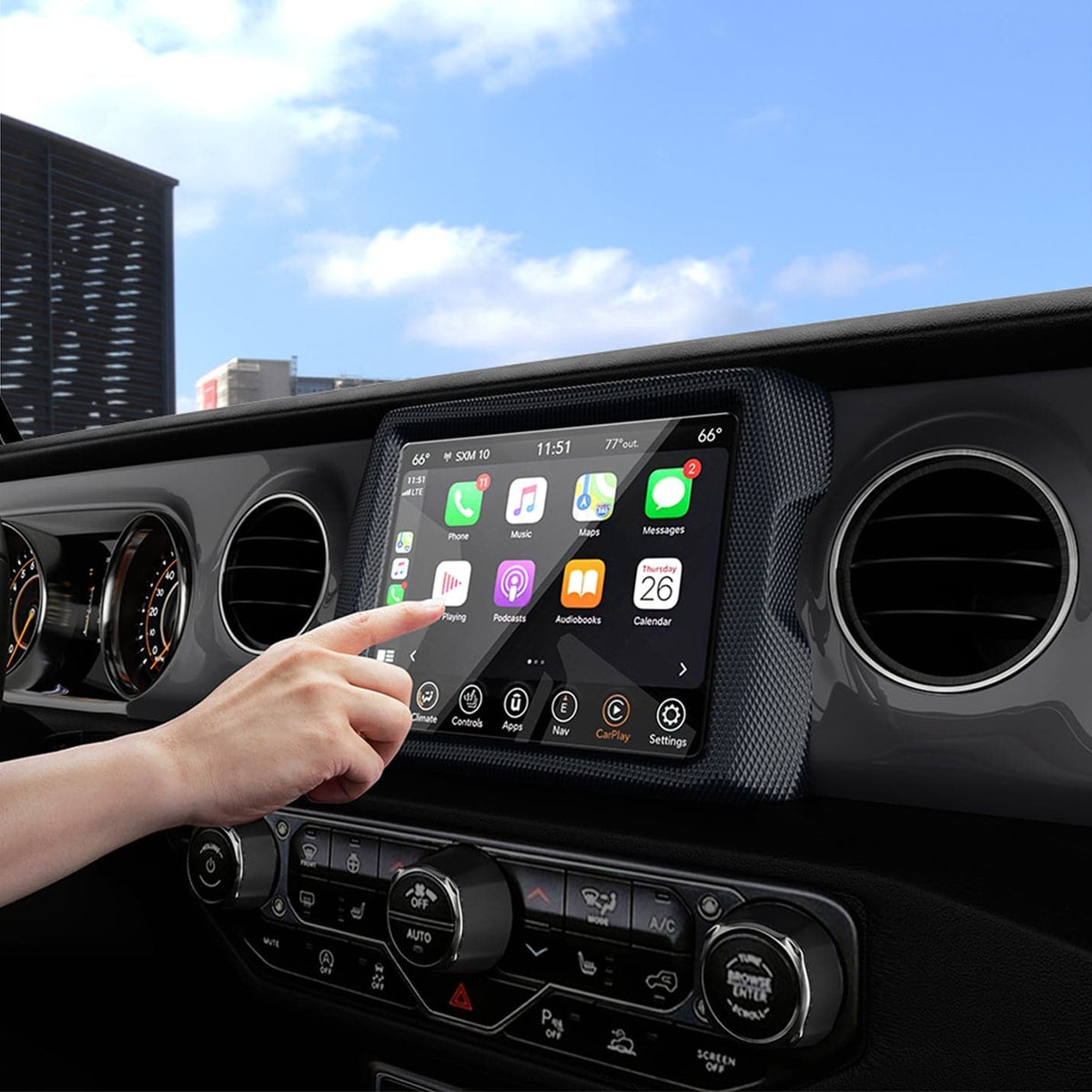 AGL04059 - Jeep Wrangler Screen Protector GLAS.tR SLIM Anti-Glare showing a hand reaching towards the display inside of car