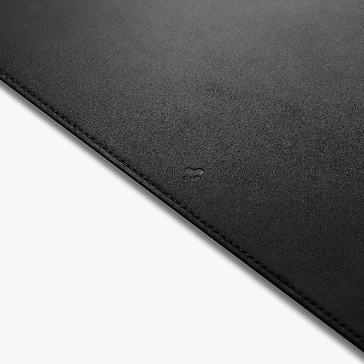 APP04762 - LD302 Desk Pad in black showing the front zoomed in on the Spigen logo