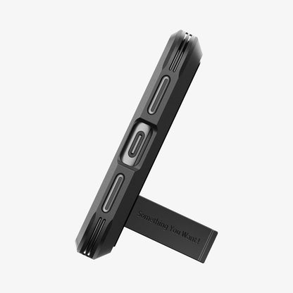 ACS06282 - Pixel 8 Case Tough Armor in black showing the bottom with device propped up by built in kickstand