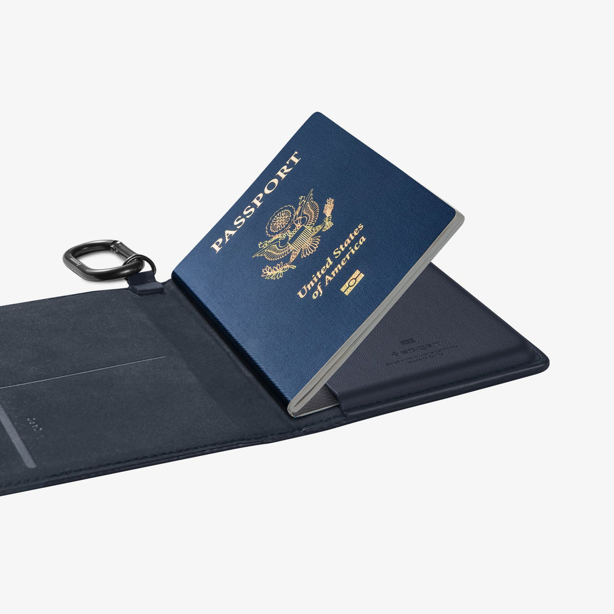 AFA08721 - Passport Holder in Navy Blue showing the inside with passport in slot and carabiner