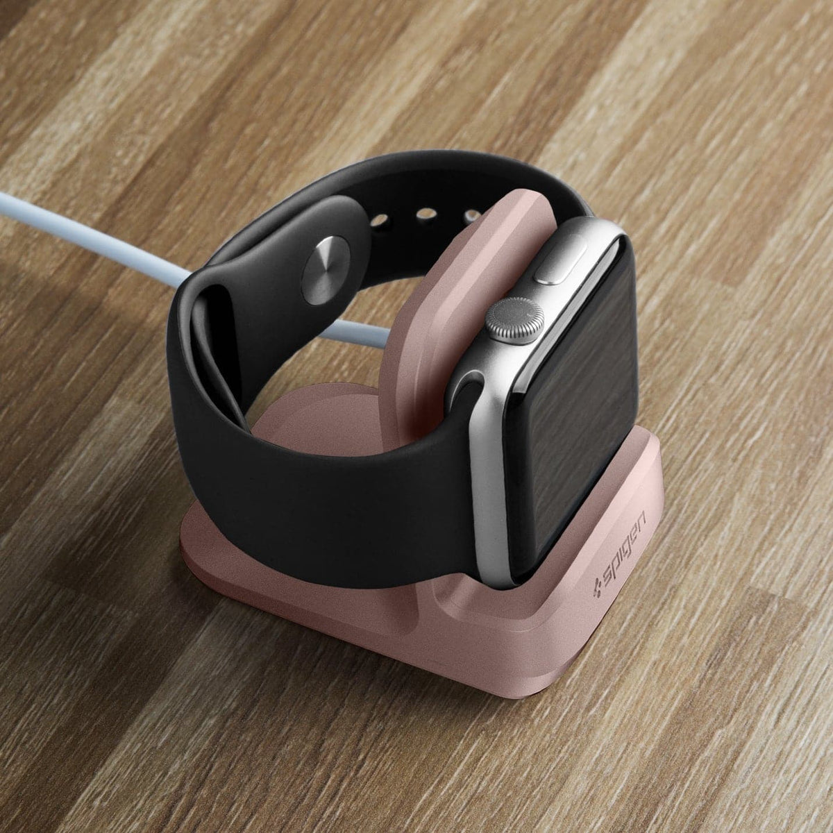 000CD21183 - Apple Watch Night Stand S350 in pink showing the front and top with watch on stand on a desk