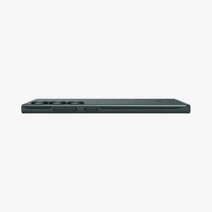 ACS07282 - Galaxy S24 Ultra Case Thin Fit in Abyss Green showing the side with side buttons and partial back on a flat surface