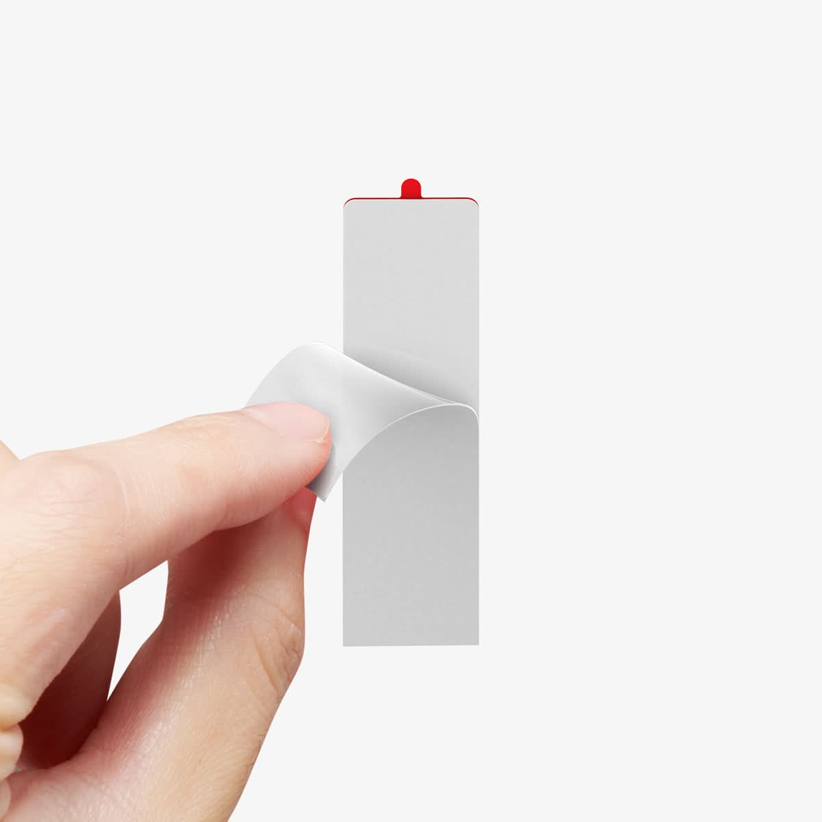 AMP06397 - PlayStation 5 Controller Mount | VG300 in White showing a person's hand pulling out the back adhesive sticker film