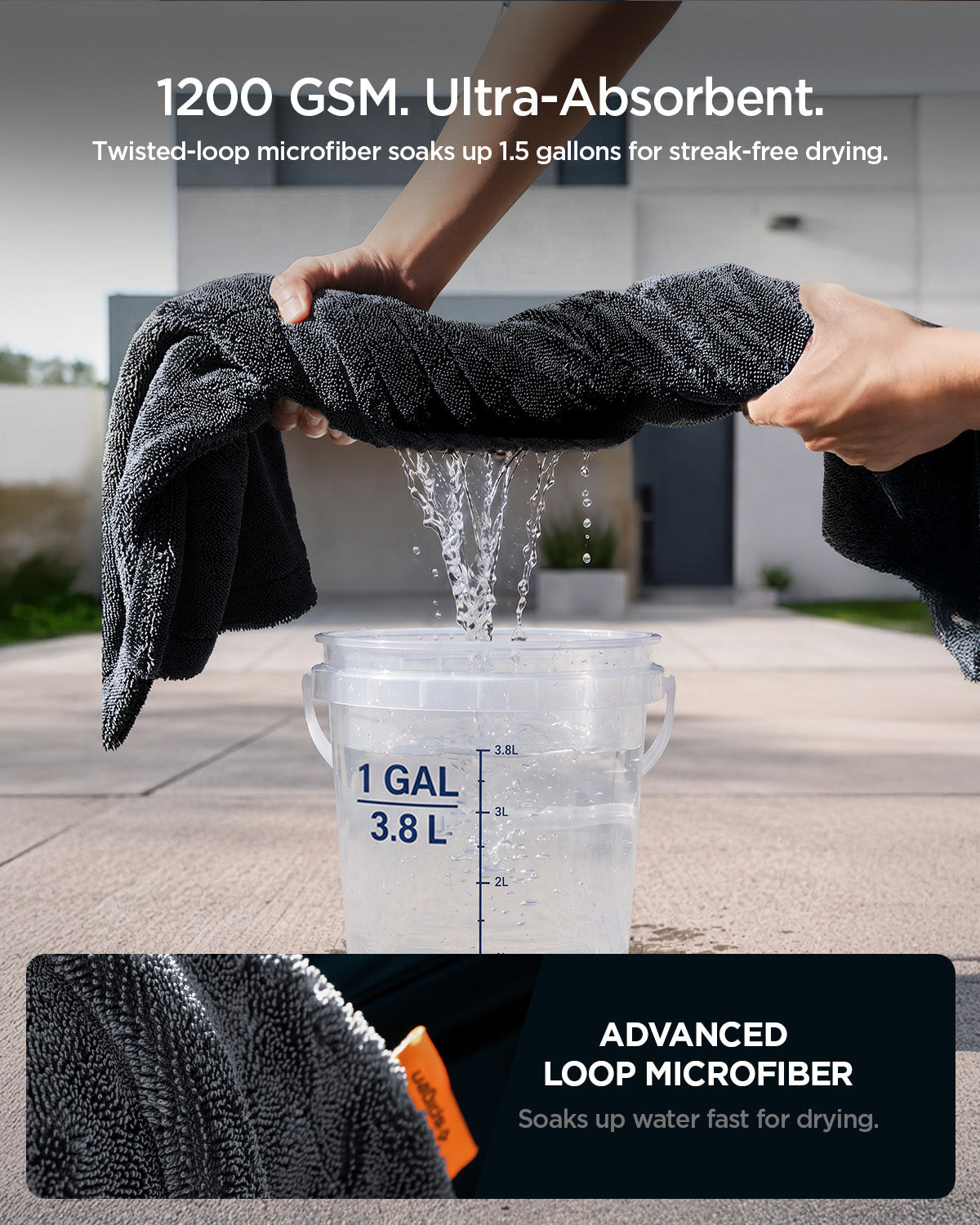 ACP11389 - Hands wringing water out of a Spigen microfiber towel over a 1-gallon bucket, demonstrating its 1200 GSM absorbency