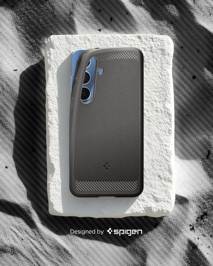 ACS08999 - Galaxy S25 Case Rugged Armor (MagFit) in Marble Gray designed by spigen. Showing the phone with the pattern on the sand.