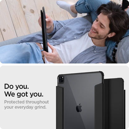 ACS02880 - iPad Pro 12.9"(2022/2021) Case Ultra Hybrid Pro in black showing a man laying staring into device in hand