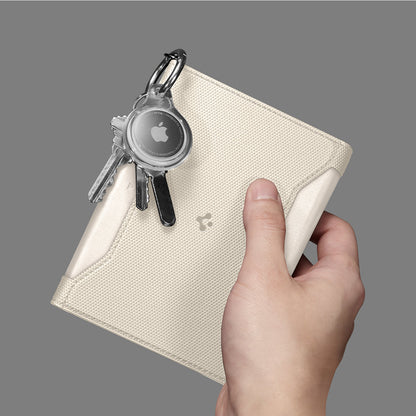 AFA08348 - Passport Holder in dune beige showing the front with carabiner attached for airtag and keys